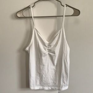 White tank top from H&M, cropped.
